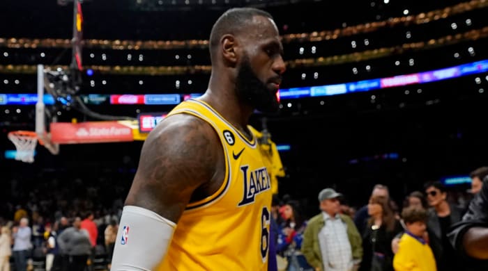 Lakers forward LeBron James walks off the court after Game 4 loss to Nuggets
